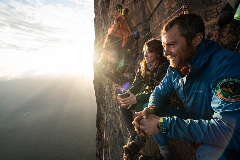 Anna and Leo enjoy the sun on the Invisible Ledge photo Coldhouse Collective Berghaus