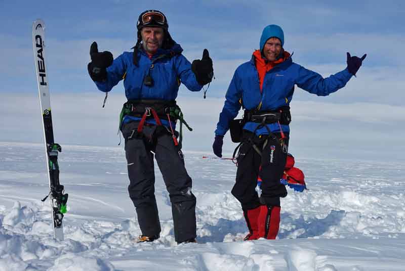 Bruce Corrie left and Leo Houlding celebrate a successful day of snowkiting in Greenland