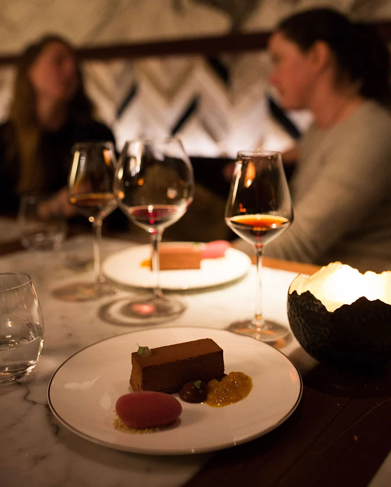 Fine dining involving Chocolate mousse mango chutney and hibiscus ice cream
