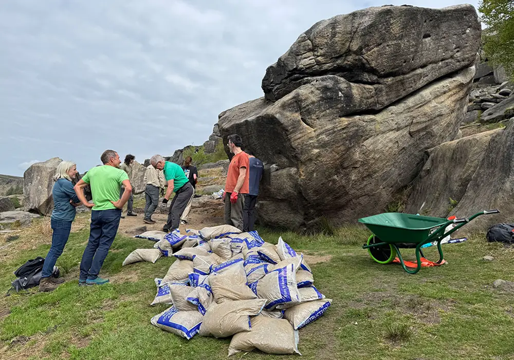 Volunteers at Stanage Plantation with bags of conservation material
