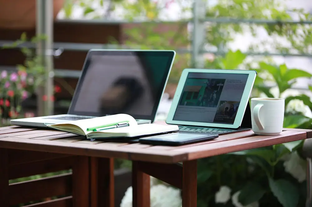 2 notebooks on a table with a mug and an open book 1757220 1280